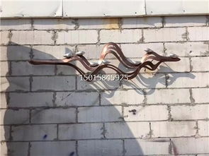 匠心雕琢 售樓部戶外不銹鋼藝術(shù)背景墻，激光圍邊與手工鍛造的藝術(shù)對(duì)話